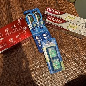 4 colgate toothpastes, 2 toothbrushes and 1 pack of floss
